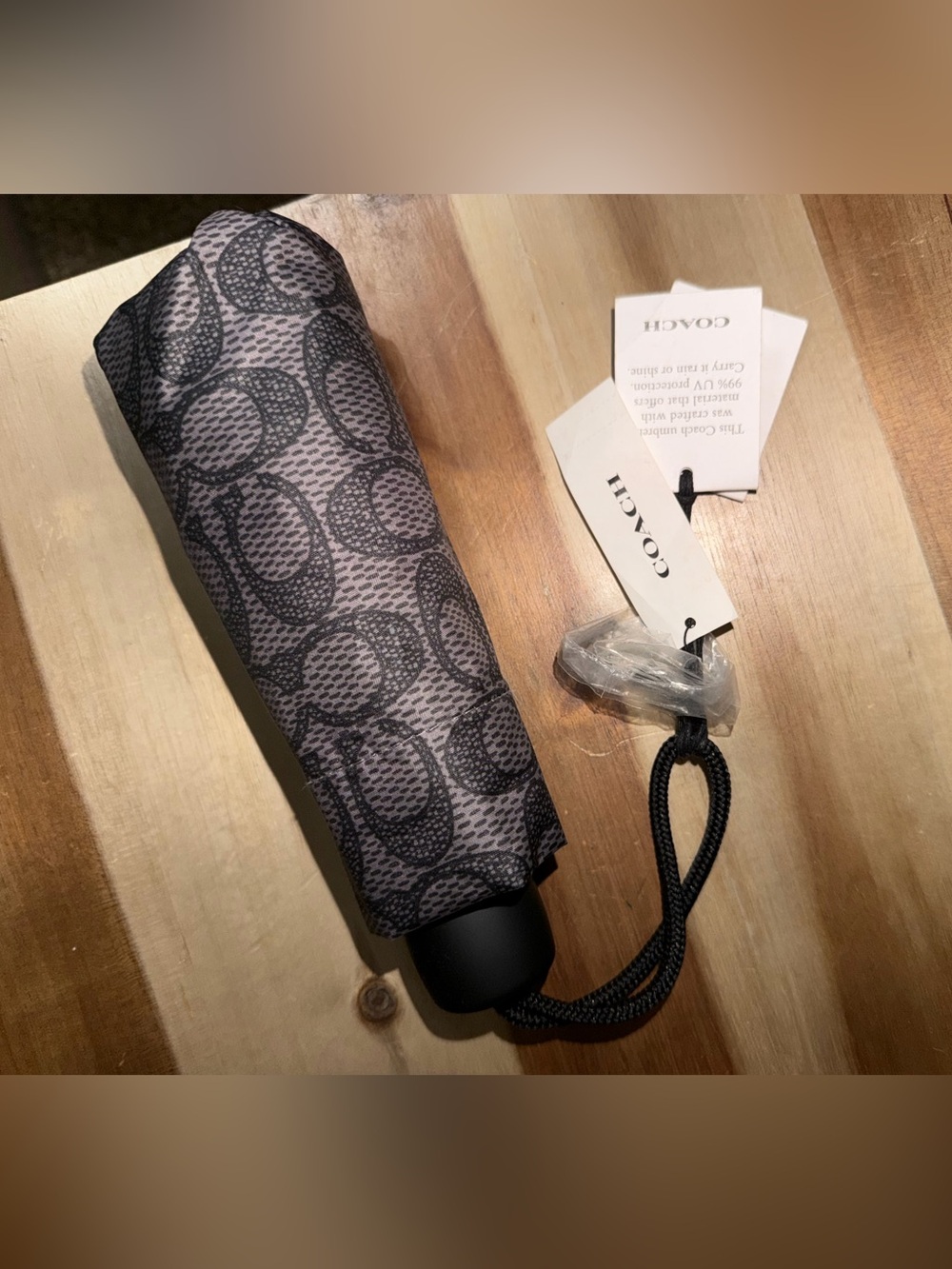 Coach Womenโs Gray and Black Signature Compact Umbrella